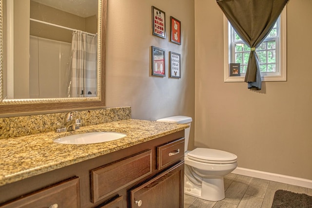 143 Rachelle Pl, Baxter, TN 38544 - full bath featuring toilet, vanity, baseboards, wood tiled floors, and curtained shower