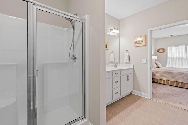 1648 Foston Ln, Gallatin, TN 37066 - bathroom with a stall shower, vanity, connected bathroom, and baseboards