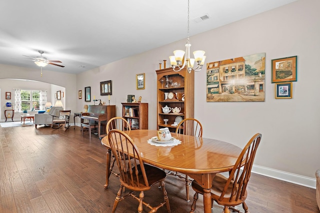 1648 Foston Ln, Gallatin, TN 37066 - dining area with dark wood-style floors, arched walkways, ceiling fan, a chandelier, and baseboards