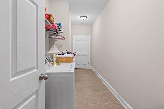 1648 Foston Ln, Gallatin, TN 37066 - washroom with washing machine and clothes dryer and baseboards