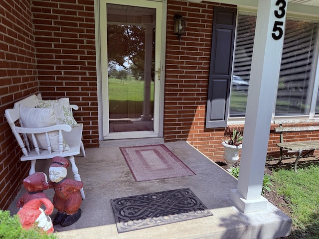 435 Richland Cir, Gallatin, TN 37066 - view of exterior entry with brick siding and a porch