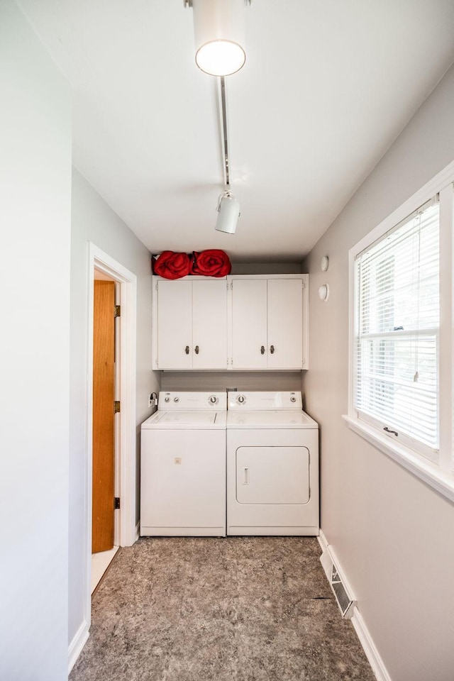 435 Richland Cir, Gallatin, TN 37066 - laundry room with cabinet space, washer and clothes dryer, and light colored carpet