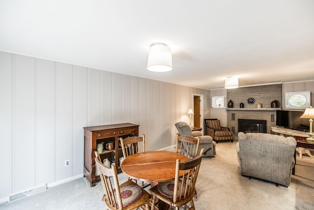 435 Richland Cir, Gallatin, TN 37066 - dining area with light colored carpet and a brick fireplace