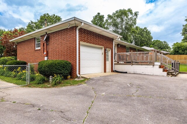 435 Richland Cir, Gallatin, TN 37066 - view of property exterior with brick siding, a garage, and asphalt driveway