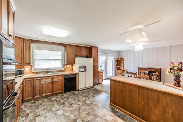 435 Richland Cir, Gallatin, TN 37066 - kitchen featuring black appliances, brown cabinets, and light countertops