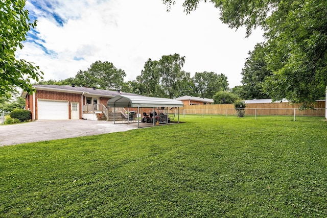435 Richland Cir, Gallatin, TN 37066 - view of yard featuring an attached garage, a carport, and driveway