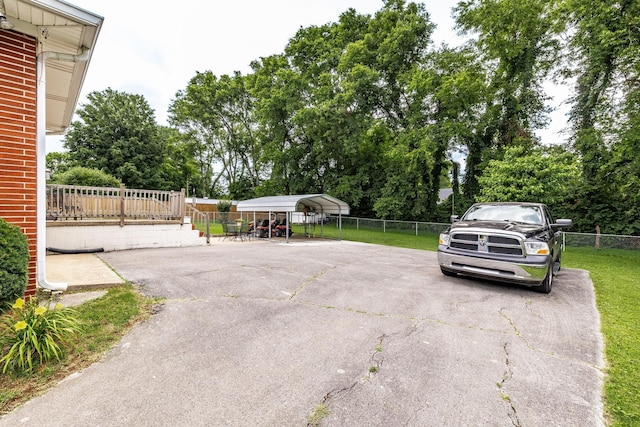 435 Richland Cir, Gallatin, TN 37066 - view of parking / parking lot with a detached carport and view of scattered trees