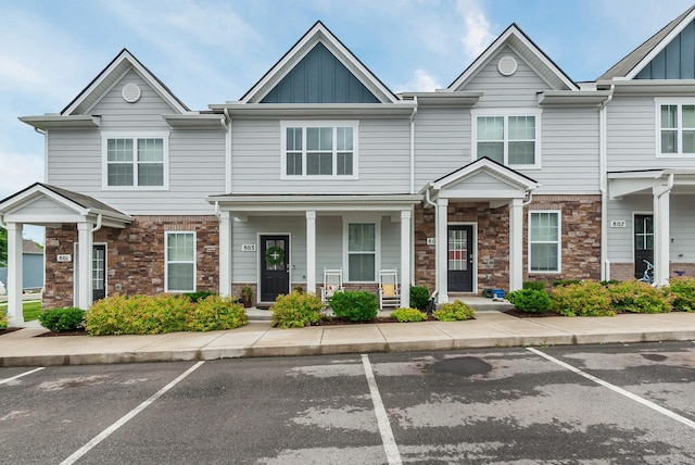 803 Dallas Dr, Columbia, TN 38401 - view of property featuring stone siding, uncovered parking, and board and batten siding