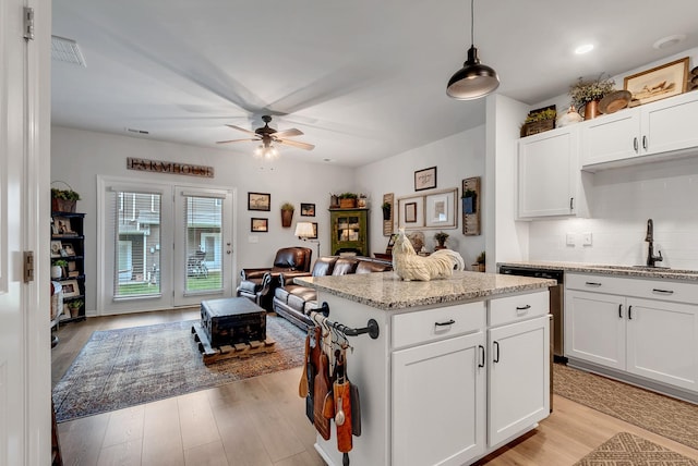 803 Dallas Dr, Columbia, TN 38401 - kitchen featuring open floor plan, stainless steel dishwasher, ceiling fan, a sink, and tasteful backsplash