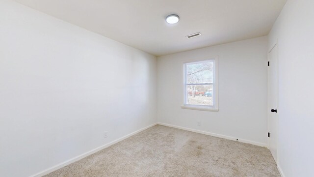 121 Highland St, La Vergne, TN 37086 - spare room featuring carpet and baseboards