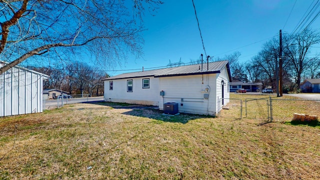 121 Highland St, La Vergne, TN 37086 - rear view of property with a gate, central AC unit, and metal roof