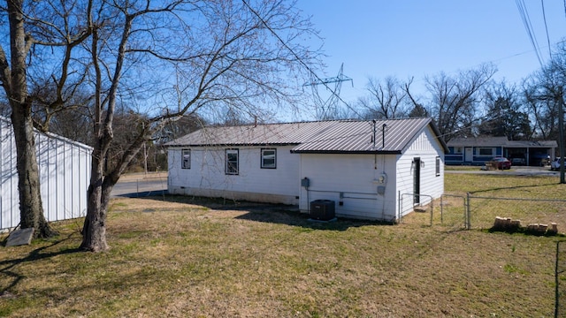 121 Highland St, La Vergne, TN 37086 - rear view of house with metal roof, crawl space, and cooling unit
