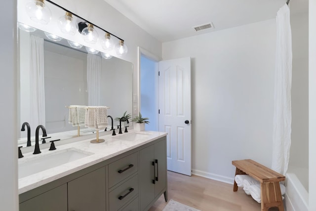 3755 Indian Creek Blvd, Murfreesboro, TN 37128 - full bathroom featuring wood finished floors, double vanity, baseboards, and a shower with shower curtain
