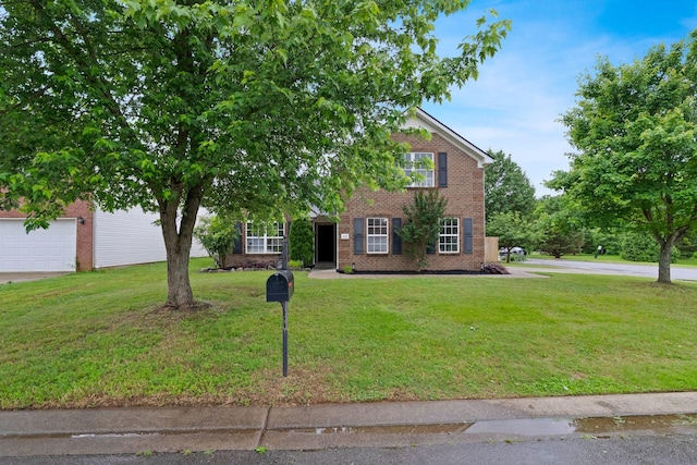 3755 Indian Creek Blvd, Murfreesboro, TN 37128 - view of front of house with brick siding, a front lawn, and a garage