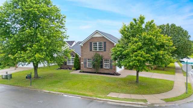 3755 Indian Creek Blvd, Murfreesboro, TN 37128 - view of front of home with brick siding, a front lawn, and concrete driveway