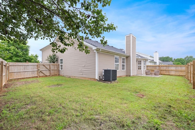 3755 Indian Creek Blvd, Murfreesboro, TN 37128 - rear view of house featuring cooling unit, a chimney, and a patio