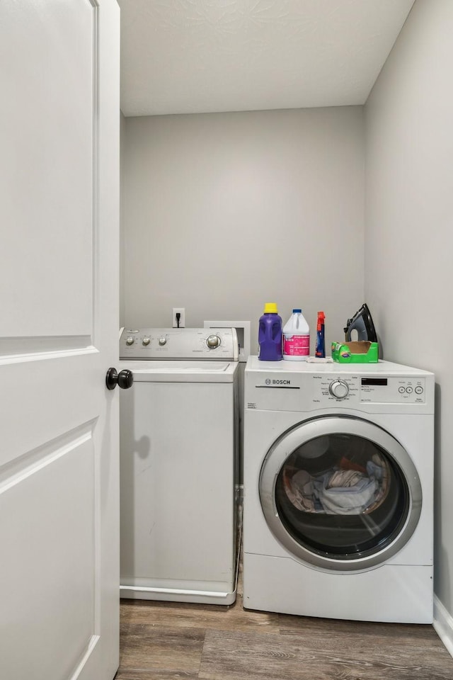 125 Vivian Ln, Carthage, TN 37030 - laundry area with washer and dryer and wood finished floors