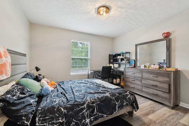 125 Vivian Ln, Carthage, TN 37030 - bedroom with wood finished floors and a textured ceiling