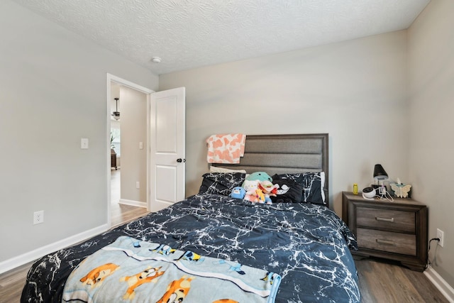 125 Vivian Ln, Carthage, TN 37030 - bedroom with wood finished floors, baseboards, and a textured ceiling