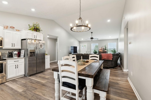 125 Vivian Ln, Carthage, TN 37030 - dining room featuring vaulted ceiling, a chandelier, ceiling fan, wood finished floors, and baseboards