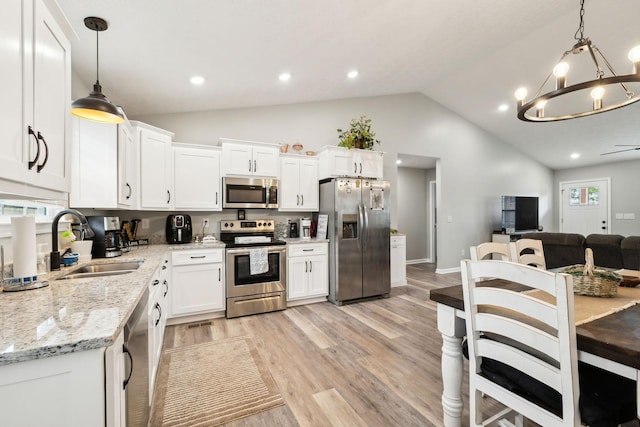 125 Vivian Ln, Carthage, TN 37030 - kitchen with stainless steel appliances, a sink, a chandelier, white cabinetry, and recessed lighting