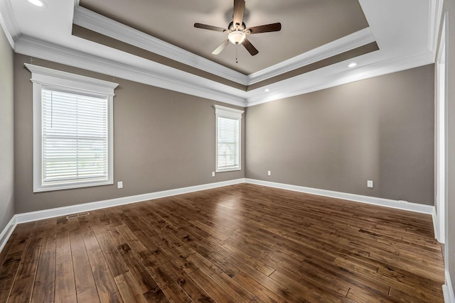 103 Rosehaven Ct, Tullahoma, TN 37388 - empty room with a raised ceiling, a ceiling fan, dark wood-style flooring, baseboards, and ornamental molding
