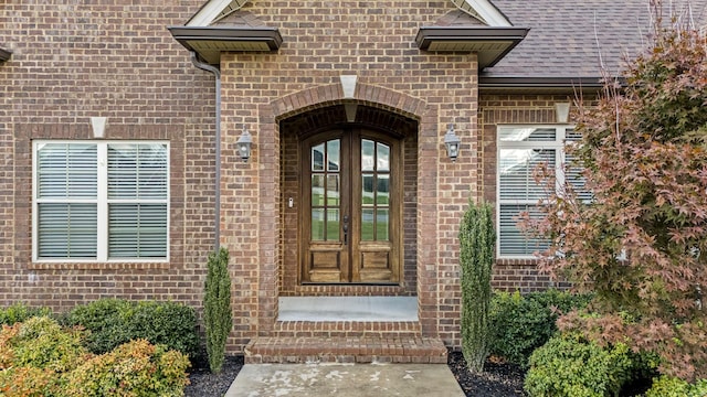 103 Rosehaven Ct, Tullahoma, TN 37388 - entrance to property featuring french doors, brick siding, and roof with shingles
