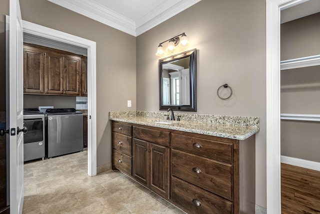 103 Rosehaven Ct, Tullahoma, TN 37388 - bathroom featuring washing machine and dryer, vanity, ornamental molding, and baseboards