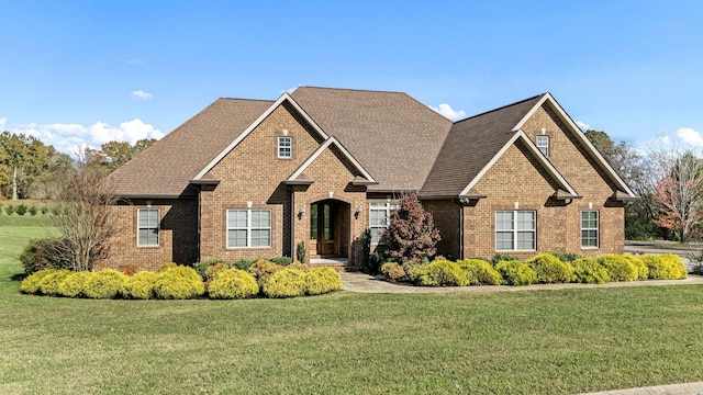 103 Rosehaven Ct, Tullahoma, TN 37388 - craftsman house featuring brick siding, a front lawn, and a shingled roof