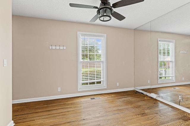 108 Agee Cir W, Hendersonville, TN 37075 - spare room featuring wood finished floors, plenty of natural light, baseboards, ceiling fan, and a textured ceiling