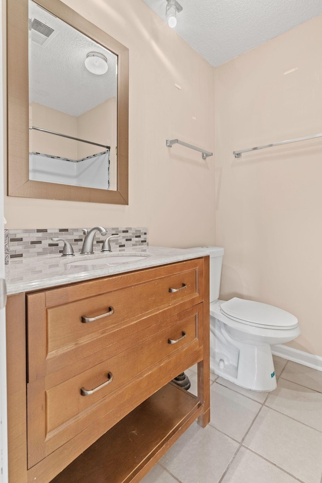 108 Agee Cir W, Hendersonville, TN 37075 - bathroom featuring vanity, toilet, a textured ceiling, tile patterned floors, and backsplash