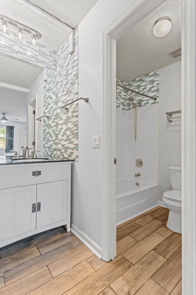 108 Agee Cir W, Hendersonville, TN 37075 - full bathroom featuring a textured ceiling, vanity, toilet, wood finished floors, and shower / bath combination