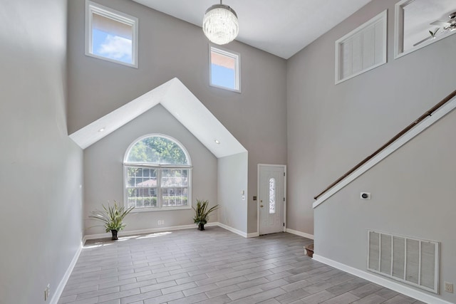 4905 Algonquin Trl, Antioch, TN 37013 - entrance foyer featuring plenty of natural light, wood finished floors, baseboards, and a towering ceiling