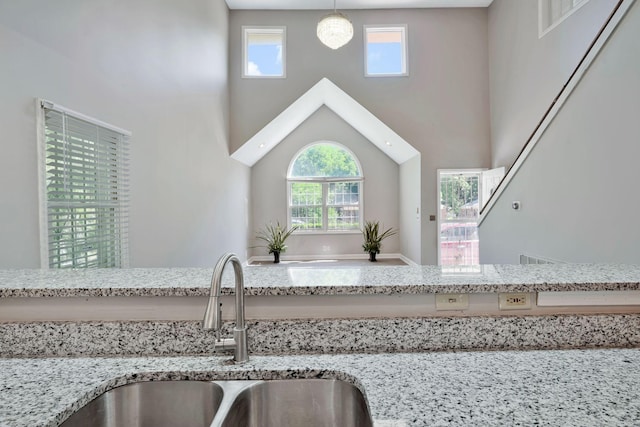 4905 Algonquin Trl, Antioch, TN 37013 - kitchen view of a sink, light stone counters, and hanging light fixtures