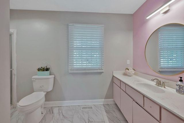 4905 Algonquin Trl, Antioch, TN 37013 - full bathroom with toilet, vanity, marble finish flooring, baseboards, and an enclosed shower