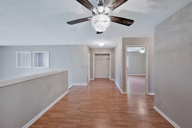 4905 Algonquin Trl, Antioch, TN 37013 - hallway featuring wood finished floors, baseboards, and a textured ceiling