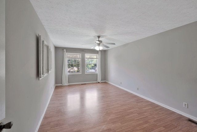 4905 Algonquin Trl, Antioch, TN 37013 - spare room with a ceiling fan, wood finished floors, a textured ceiling, and baseboards