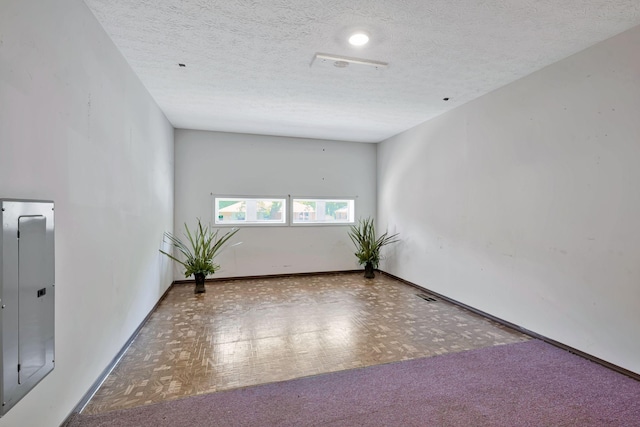 4905 Algonquin Trl, Antioch, TN 37013 - unfurnished room featuring a textured ceiling, electric panel, and baseboards