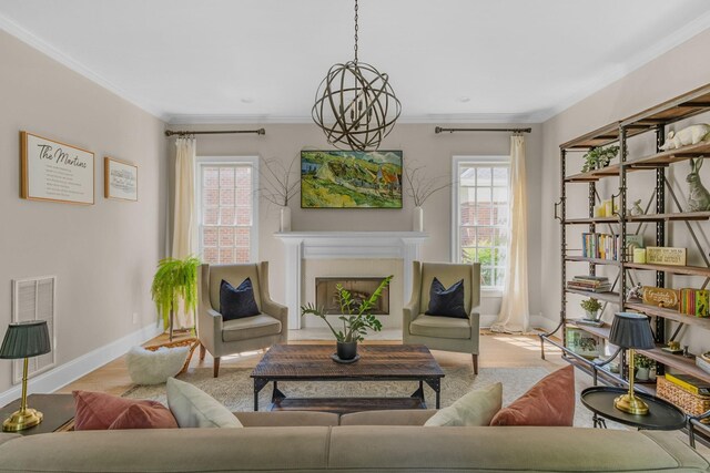 1422 Primrose Ln, Franklin, TN 37064 - living area with plenty of natural light, baseboards, ornamental molding, a fireplace with flush hearth, and a chandelier