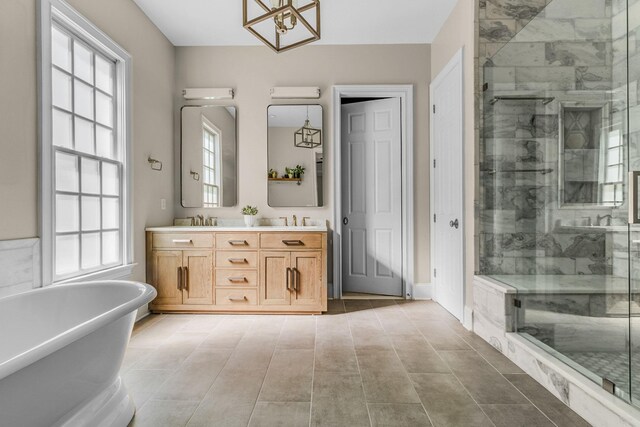 1422 Primrose Ln, Franklin, TN 37064 - bathroom with double vanity, a stall shower, a soaking tub, and a chandelier
