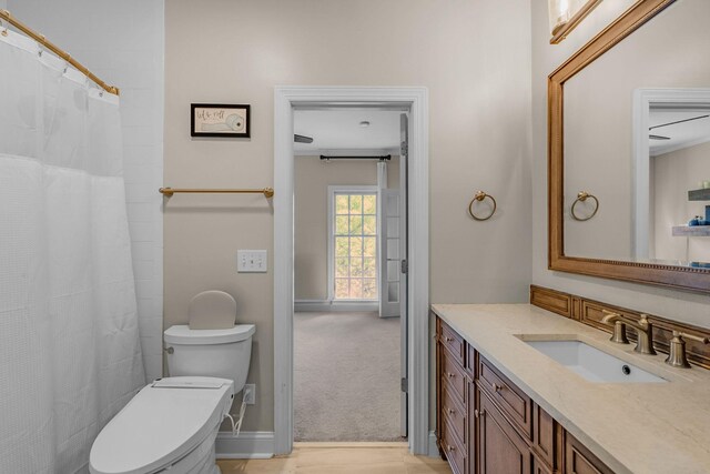 1422 Primrose Ln, Franklin, TN 37064 - full bathroom featuring toilet, vanity, curtained shower, and baseboards