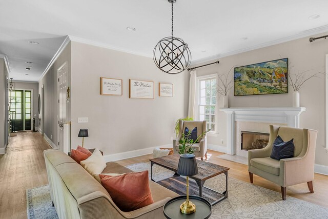 1422 Primrose Ln, Franklin, TN 37064 - living room featuring healthy amount of natural light, light wood-style floors, ornamental molding, baseboards, and recessed lighting