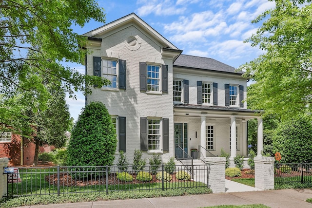 1422 Primrose Ln, Franklin, TN 37064 - view of front of property with brick siding, a porch, and a fenced front yard