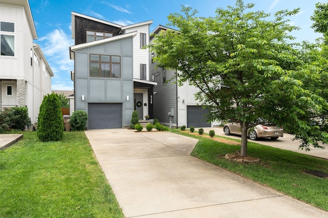 835B Dewees Ave, Nashville, TN 37204 - contemporary house with board and batten siding, driveway, a front lawn, and a garage