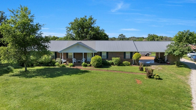 7736 Stewarts Ferry Pike, Mount Juliet, TN 37122 - single story home with covered porch, a front lawn, metal roof, an attached carport, and driveway