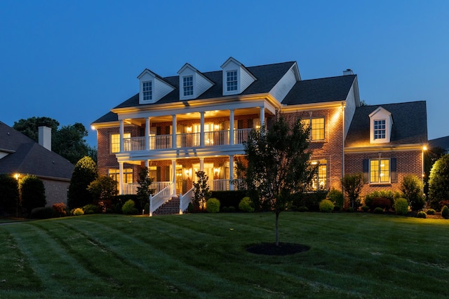 9166 Sydney Ln, Brentwood, TN 37027 - view of front facade featuring a balcony, covered porch, brick siding, and a front yard