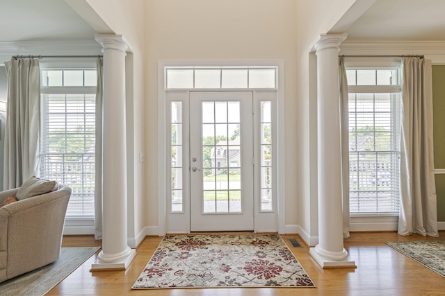 9166 Sydney Ln, Brentwood, TN 37027 - entryway with decorative columns, plenty of natural light, and wood finished floors