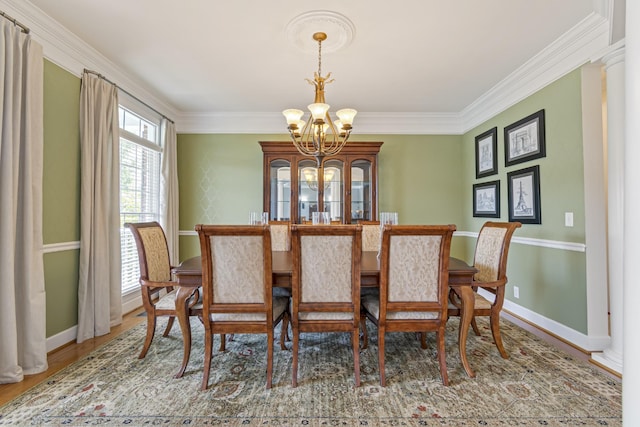 9166 Sydney Ln, Brentwood, TN 37027 - dining room with a chandelier, ornamental molding, baseboards, and wood finished floors