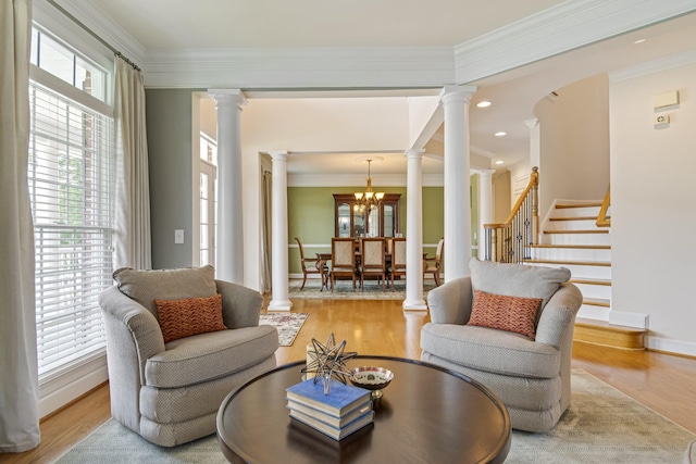 9166 Sydney Ln, Brentwood, TN 37027 - living room with decorative columns, plenty of natural light, wood finished floors, ornamental molding, and recessed lighting