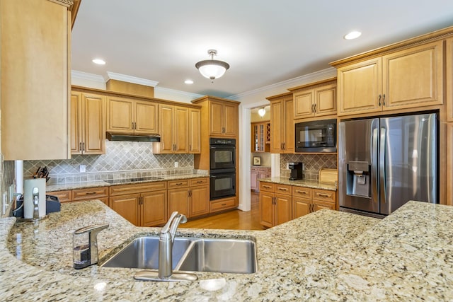 9166 Sydney Ln, Brentwood, TN 37027 - kitchen featuring black appliances, a sink, crown molding, under cabinet range hood, and light stone countertops